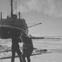 Measuring ice thickness. CCGS John A. Macdonsald in the background. (Melliville Sound, 1996)
