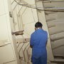 View inside the bow-shoulder healing tank of the CCGS Louis S. St. Laurent, during the installation of strain gauges on the hull.  The strain gauges were used to measure ice forces on the hull. (1993)